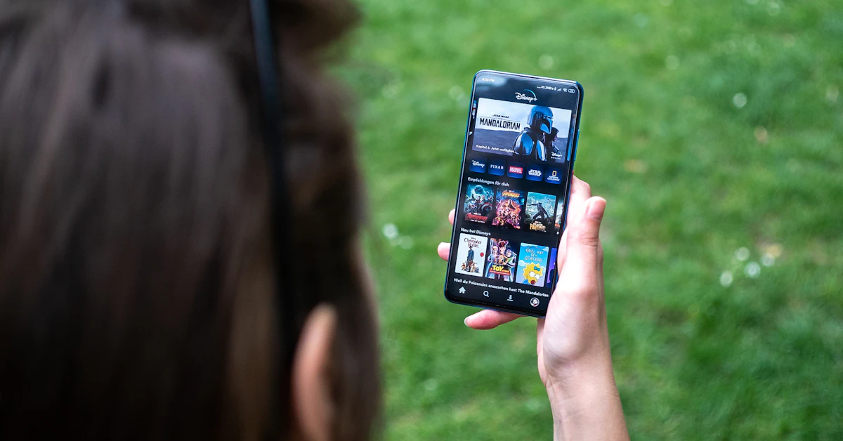 woman holding black android smartphone